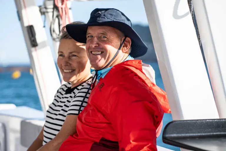 Captain and First Mate Sitting on a catamaran