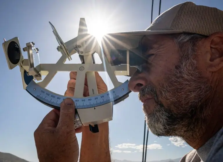 Tony Cook, sailing instructor using a chronometer for navigation
