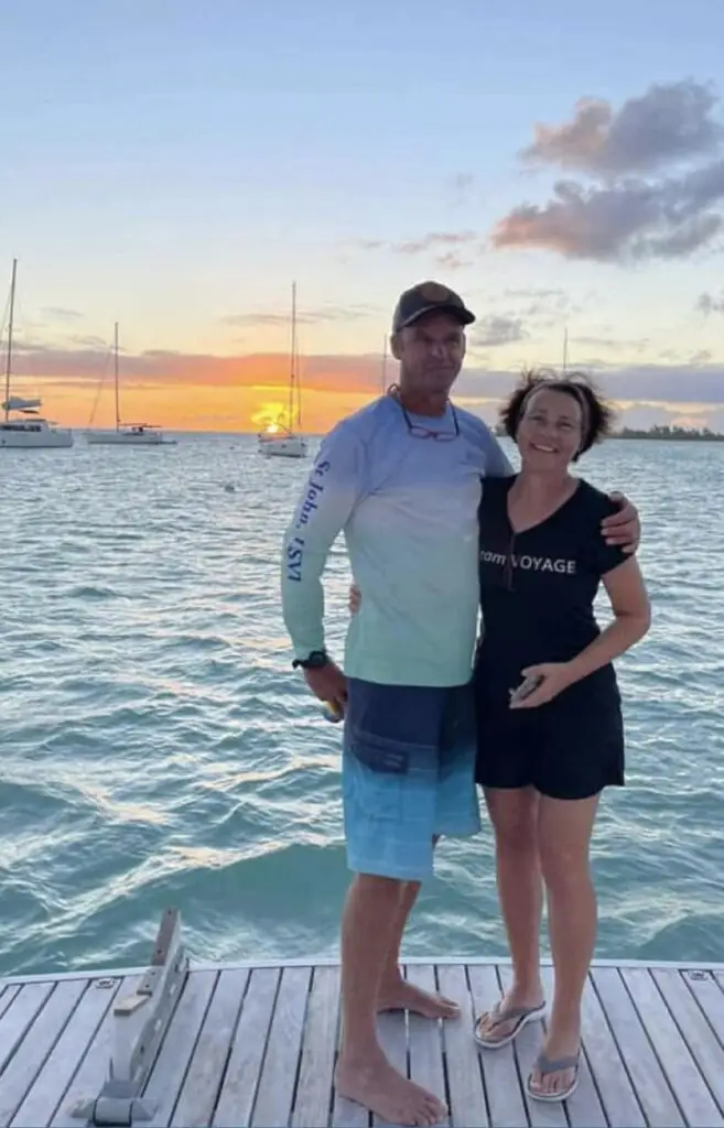 Tony Cook and Claudia Fioravantu standing on a yacht in the Bahamas